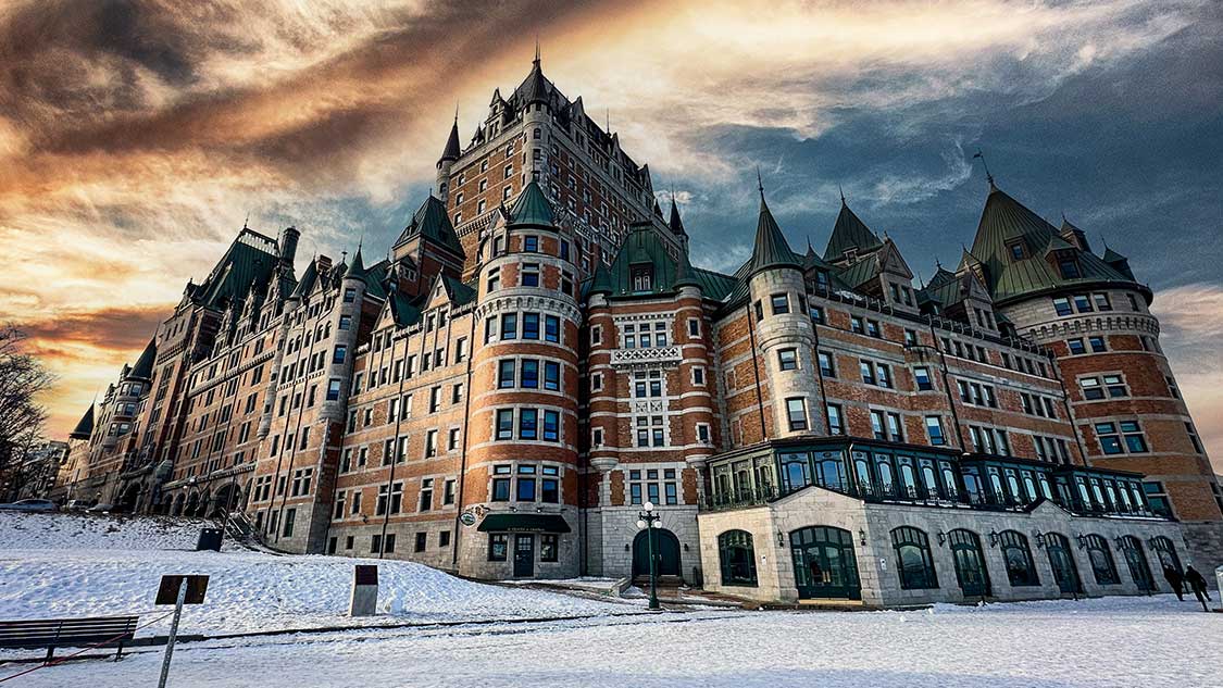 A castle-like Chateau Frontenac at sunset showcaing the best food in Quebec City